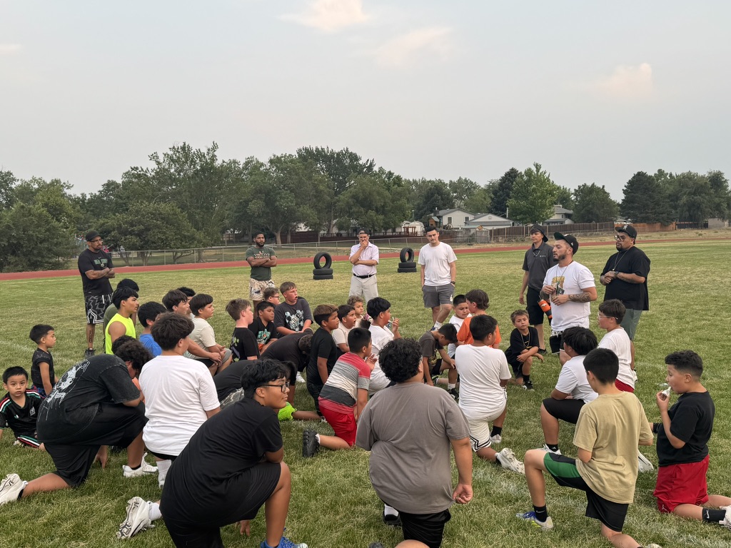 Coach Eli addressing the team at practice